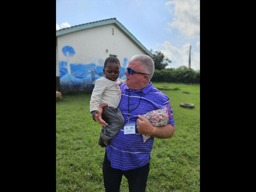 Bart Grant holding a child at the Nairobi Children's Rescue Center