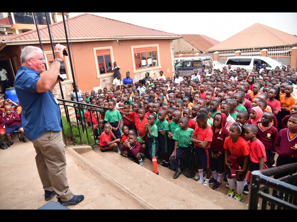 Bart Grant singing in a school in Uganda