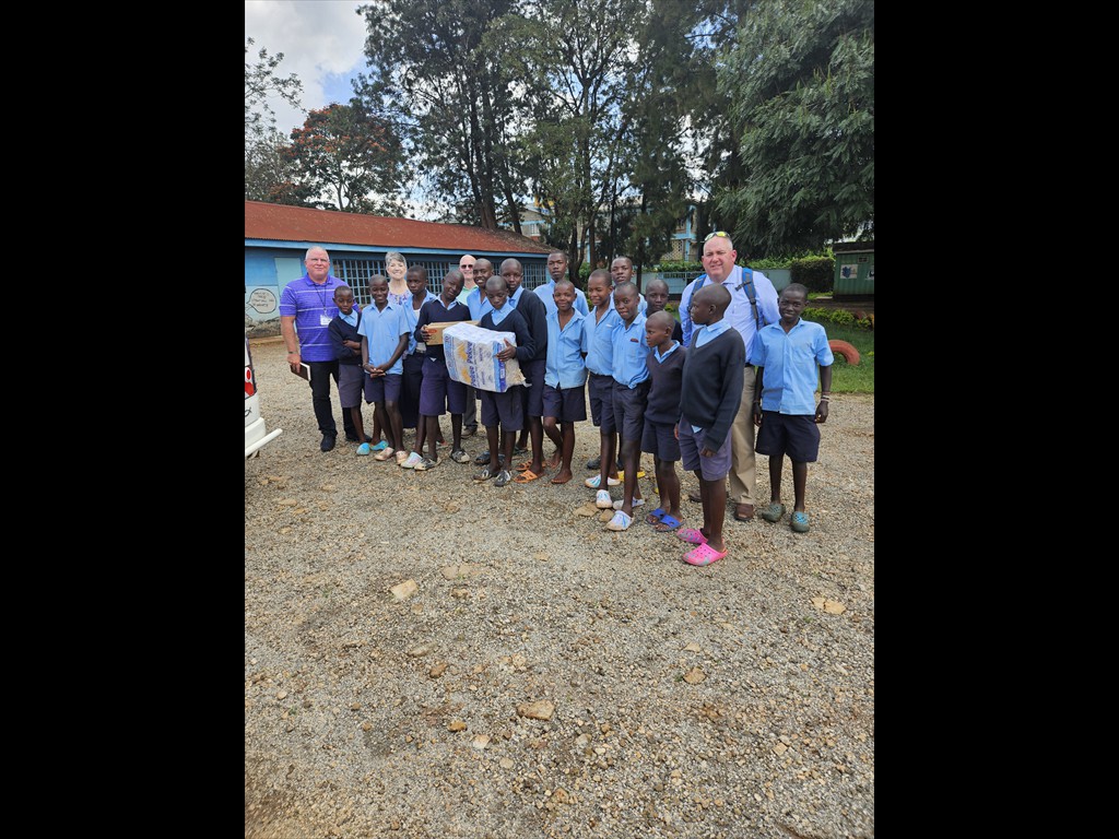 GIMI team giving soap, flour, and toilet tissue to a juvenile center